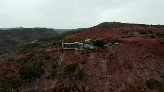 Aerial view of stunning viewpoint Mirador de Abrante with glass observation balcony above Agulo village in La Gomera