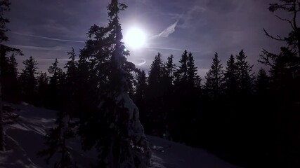 Snowy mountains in low clouds and blue sky at sunset in winter. Panoramic landscape with beautiful snow covered rocks in fog in frosty evening. Aerial view of high peaks. Alps in Dolomites, Italy - Powered by Adobe
