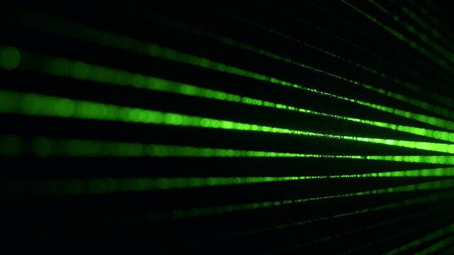 Dust particles in green laser light beam from diffraction grating