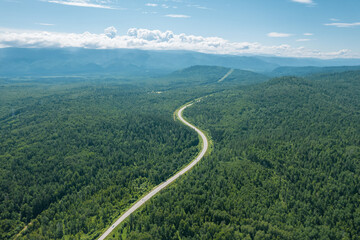 Aerial view of the road of Lake Baikal. A road passing through a coniferous forest, aerial...