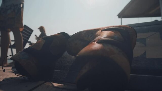 Boots fixed to the Wakeboard. Sunny Summer Day at Wakepark for Relaxation. The concept of water sports, active life