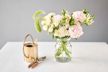 Beautiful flower arrangement in a glass vase. Flowers bunch, set for interior. Fresh cut flowers for decoration home. European floral shop. Delivery fresh cut flower.v