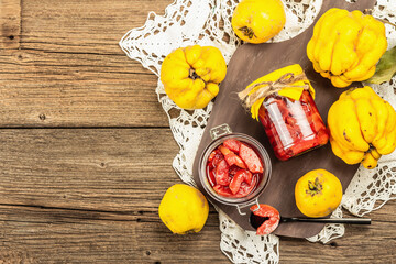 Homemade quince jam in a glass jar. Fresh fruits, sweet marmalade,vintage arrangement