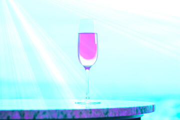青い風景に溶け込むピンク紫のシャンペングラスと白い光とコピースペース