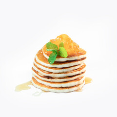 stack of freshly home made pancakes isolated over white background, traditional americal breakfast meal, studio photo shot. High quality photo