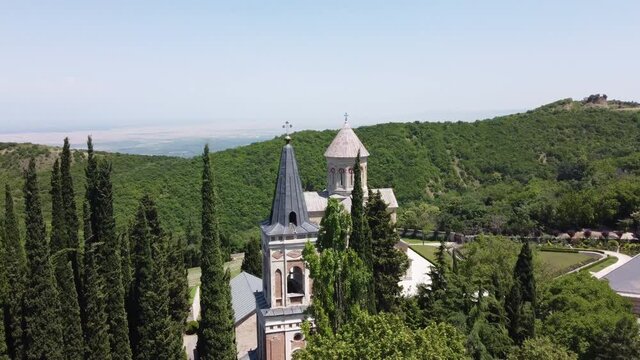 The Monastery of St. Nino at Bodbe, a Georgian Orthodox monastic complex and the seat of the Bishops of Bodbe. Arial view. Flyover.