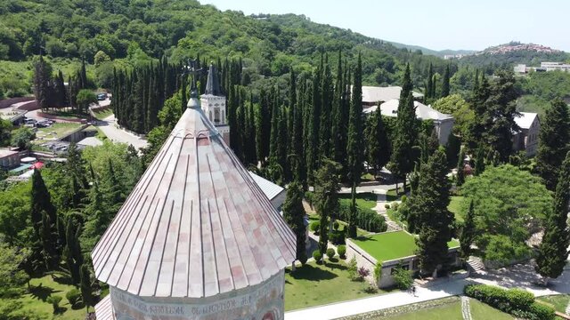 Flying over the dome and cross of Bodbe's St. Nino's Convent. Looking down at the beautiful green gardens.