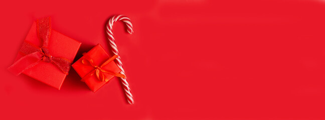 Gift, lollipop, candy on a red background. Banner.
