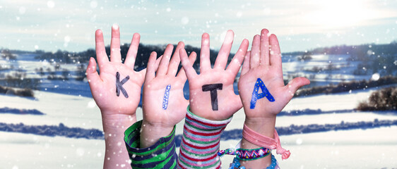 Children Hands Building Word KITA Means Kindergarden, Snowy Winter Background - obrazy, fototapety, plakaty