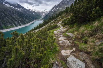 Fototapeta na wymiar Beautiful view of Schlegeis Stausee on mountain hiking path trail. Zillertal, Austria, Europe