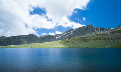Fototapeta na wymiar Mountains at the end of spring. mountain crater lake and mountain landscape