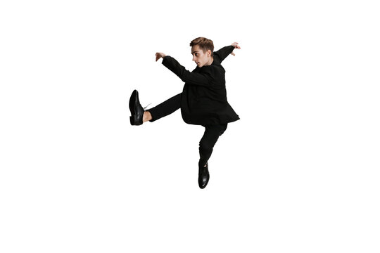 Young Man In Black Business Suit Dancing Isolated On White Background. Art, Motion, Action, Flexibility, Inspiration Concept.