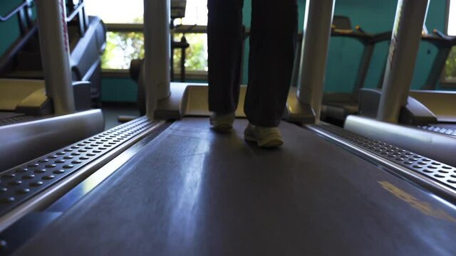 Close up of women's feet on treadmill