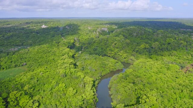 Yuma river snaking through tropical jungle landscape of La Altagracia province, Caribbean