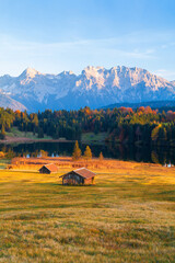 Amazing mountain pond on the Geroldsee lake (Wagenbr&uuml;chsee), in the background overlooking the Alpspitz and Zugspitz mountains at sunset, Garmisch-Partenkirchen, Bavaria