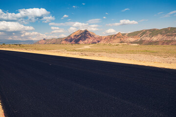 Laying of new black asphalt. Renovation of the expressway and the highway outside the city.