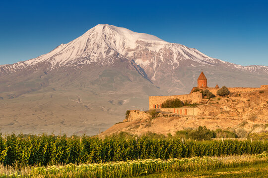 One of the main travel destinations of Armenia - popular monastery of Khor Virap and the famous Mount Ararat illuminated by sunlight at dawn