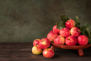Background with harvested red apples. Close-up of a heap of red apples