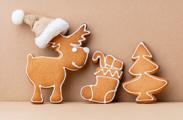 Gingerbread man, cookies and Christmas decor on pastel background.