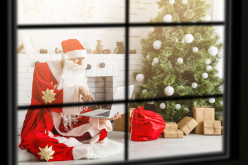 Fototapeta premium wiew through the window, Christmas Tree on background, winter holiday concept,