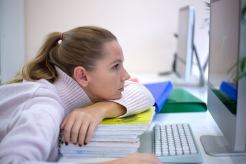 Naklejka premium young woman is sad at the workplace. office work concep