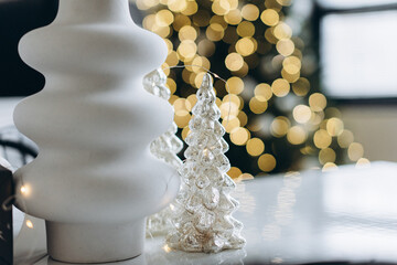 decorative christmas tree on background of bokeh garlands