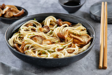Asian noodles with mushrooms in bowl