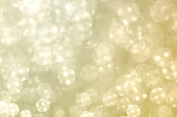 Blurred background with round bokeh in gentle yellow color. Selective focus. Bright bokeh in...