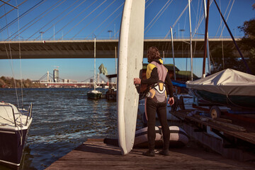 Windsurfer surfing on a windy day at the river.