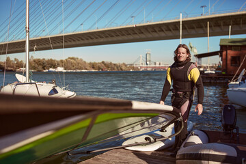 Windsurfer surfing on a windy day at the river.