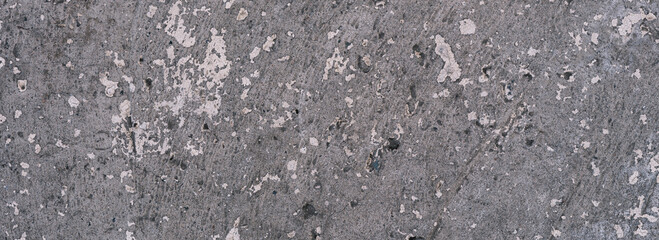 Concrete surface with old paint residues. Color - Topaz, Alto, Hue Gray. Panoramic backdrop concept.