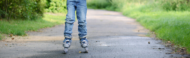 Incline Skating child, learning a new sport activity, outdoor, summertime