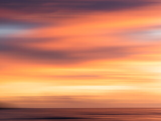 Fototapeta na wymiar Long Exposure sunset, streaky colors in the sky, wallpaper, background