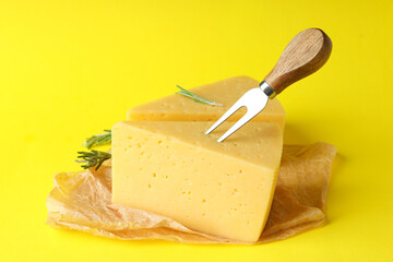 Concept of cooking eating with hard cheese on yellow background