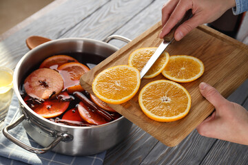 Concept of cooking  mulled wine on gray table