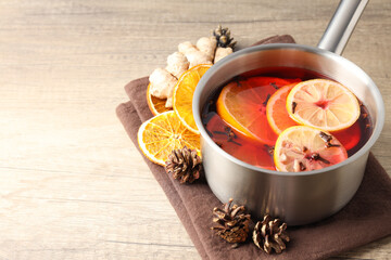 Concept of cooking  mulled wine on wooden background