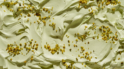 Creamy pistachio ice-cream with chopped fresh nuts