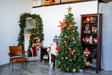 New Year and Christmas. Interior shot. Decorated Christmas tree, preparations for the new year Modern apartment. Santa and nutcracker, Red staff.