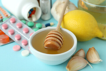 Concept of treatment colds with honey and garlic, close up