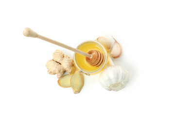 Concept of treatment colds with honey and garlic isolated on white background
