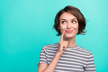 Photo of young dreamy happy cheerful woman smile look empty space think isolated on teal color background