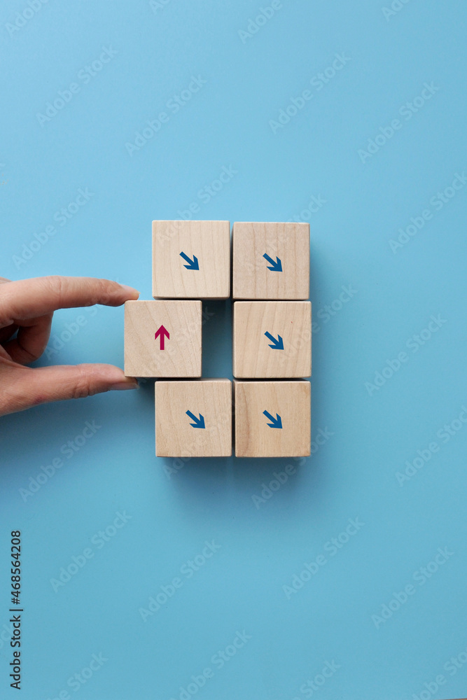 Poster many arrows point in one direction, and one moves in the other direction. a symbol of choosing a dif