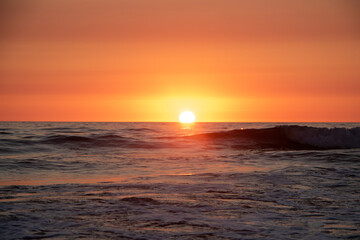 Beautiful orange Sunset at the Beach in El Palmar Andalucia Spain at the Costa de la Luz
