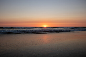 Fototapeta na wymiar Beautiful orange Sunset at the Beach in El Palmar Andalucia Spain at the Costa de la Luz