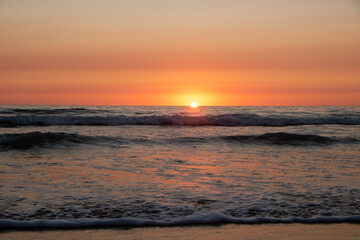 Fototapeta premium Beautiful orange Sunset at the Beach in El Palmar Andalucia Spain at the Costa de la Luz
