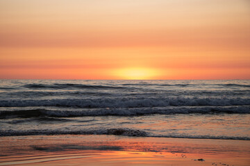 Beautiful orange Sunset at the Beach in El Palmar Andalucia Spain at the Costa de la Luz