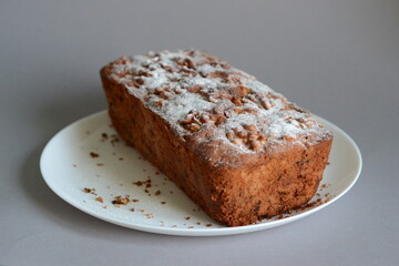 chocolate cake with nuts on a white plate