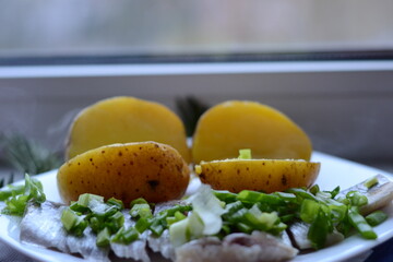 fresh out the oven cultural food. potatoes with herring and onion