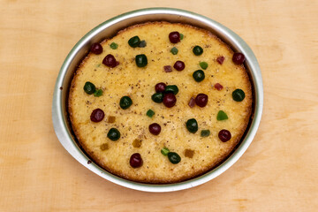 Cake in Cake Pan Decorated with Tuti Futi, Cake in Cake Pan, On the Table, On the Wooden Table, Cherry, Berry