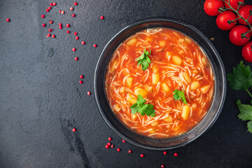 minestrone red tomato soup first dish meal snack on the table copy space food background rustic. top view keto or paleo diet veggie vegan or vegetarian food no meat